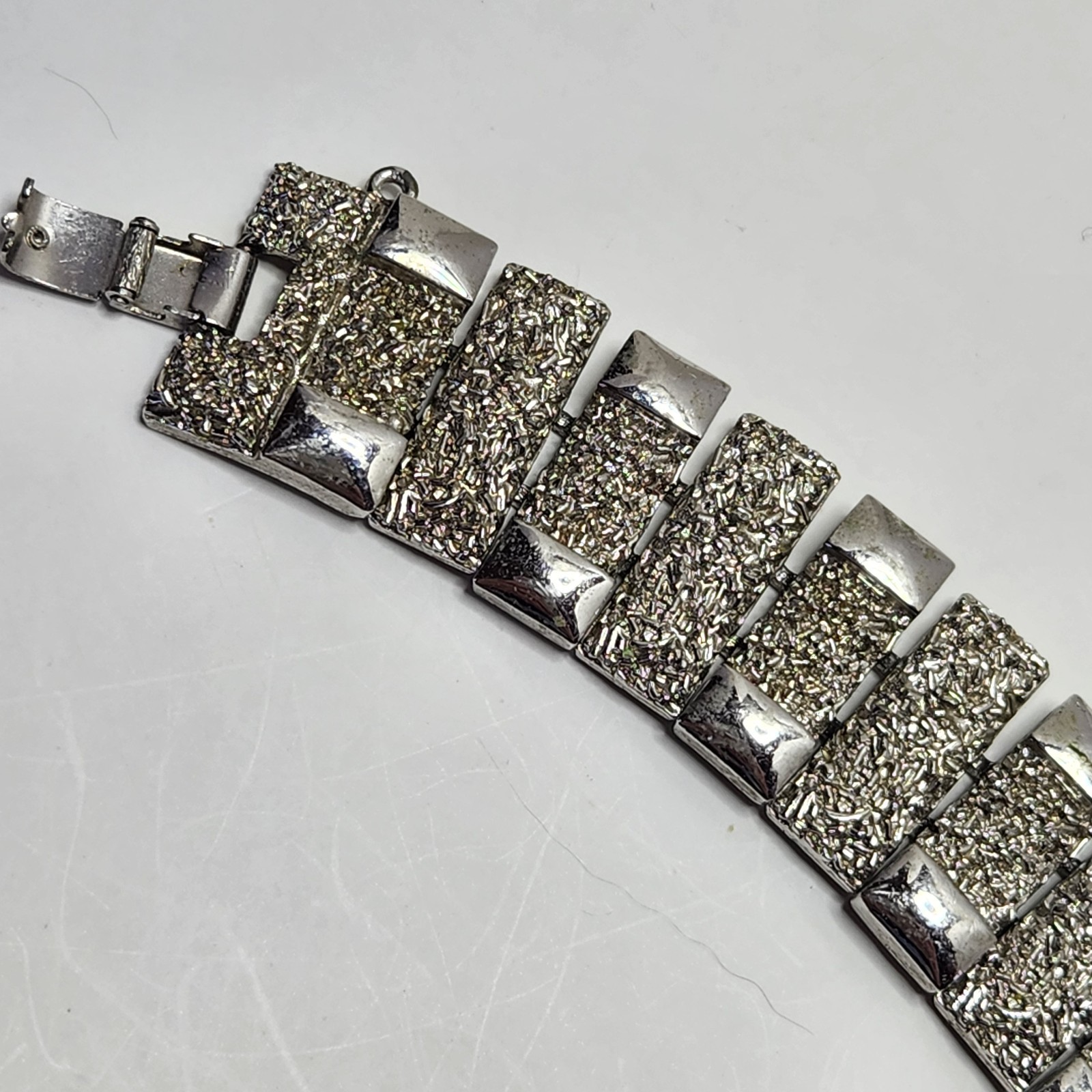 Vintage Monet Silvertone Bracelet Textured 1″ wide 7″ Fold Over Clasp No Safety