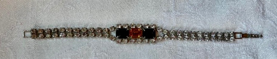 Vintage rhinestone bracelet, small clear stones,gold & black center settings