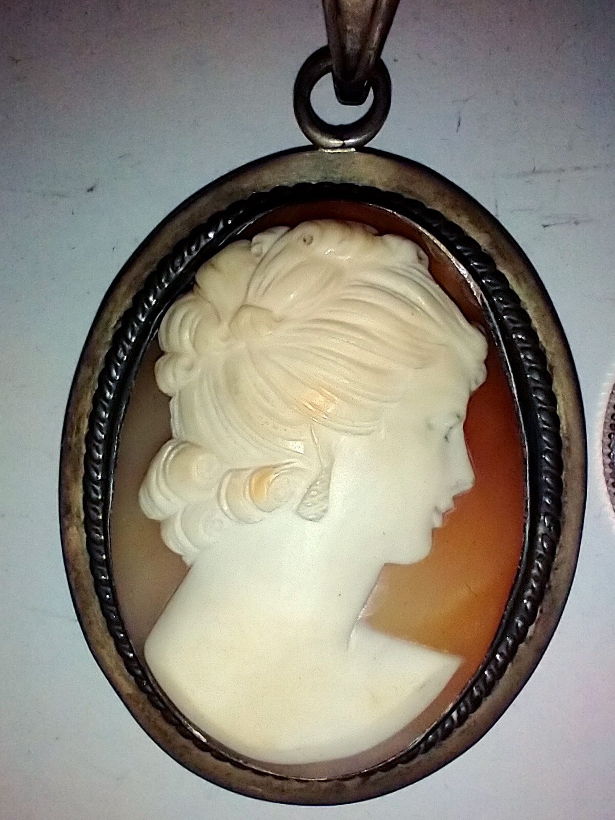 Old Cameo pendant 1.5 x 2 inches Almost looks like she has two faces