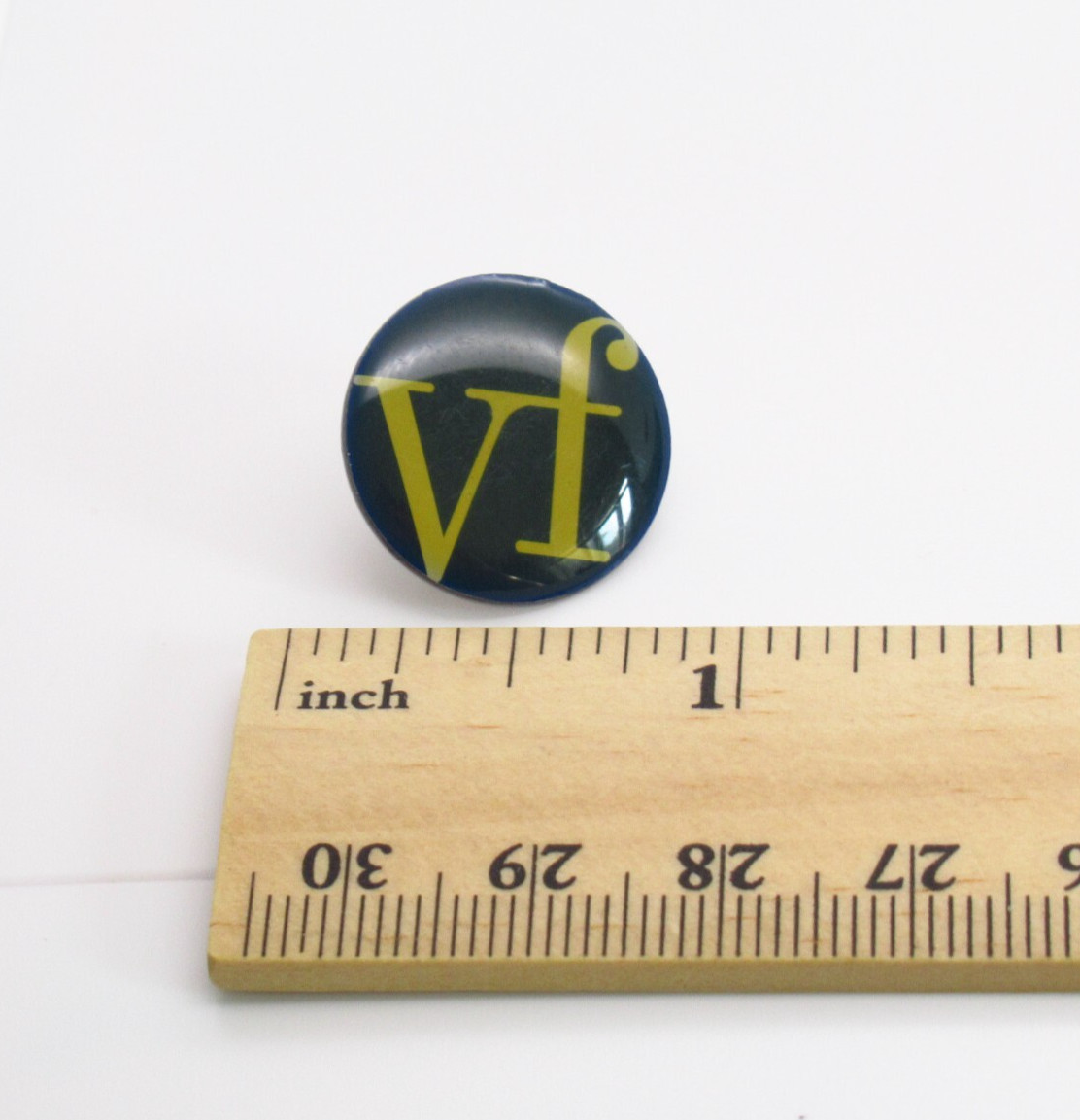 VF Sportswear Pin Yellow Letters Black Background Logo Lapel Pin