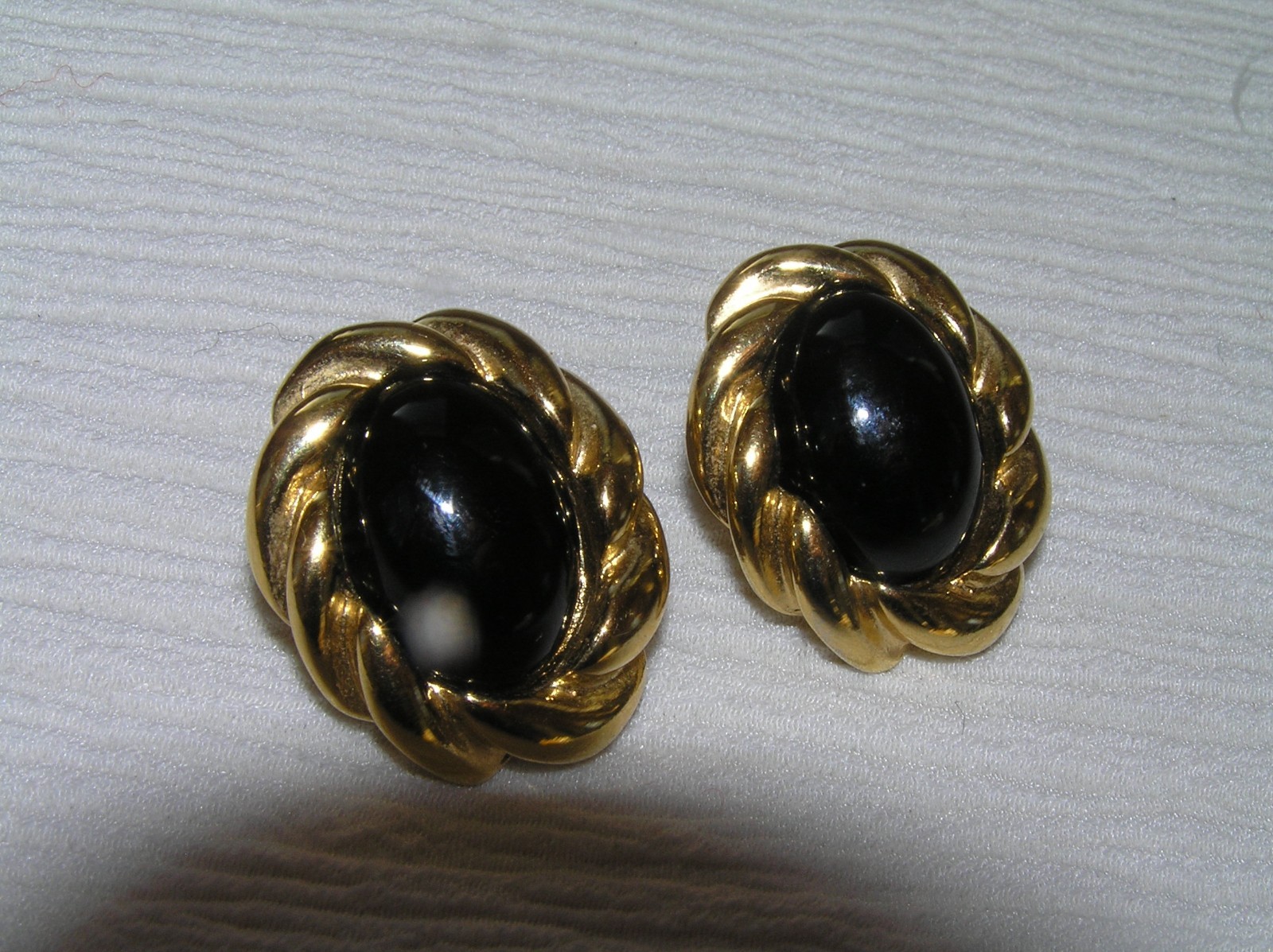 Estate KJL Signed Twist Oval Goldtone with Magnetic Black Plastic Cab Post Ear