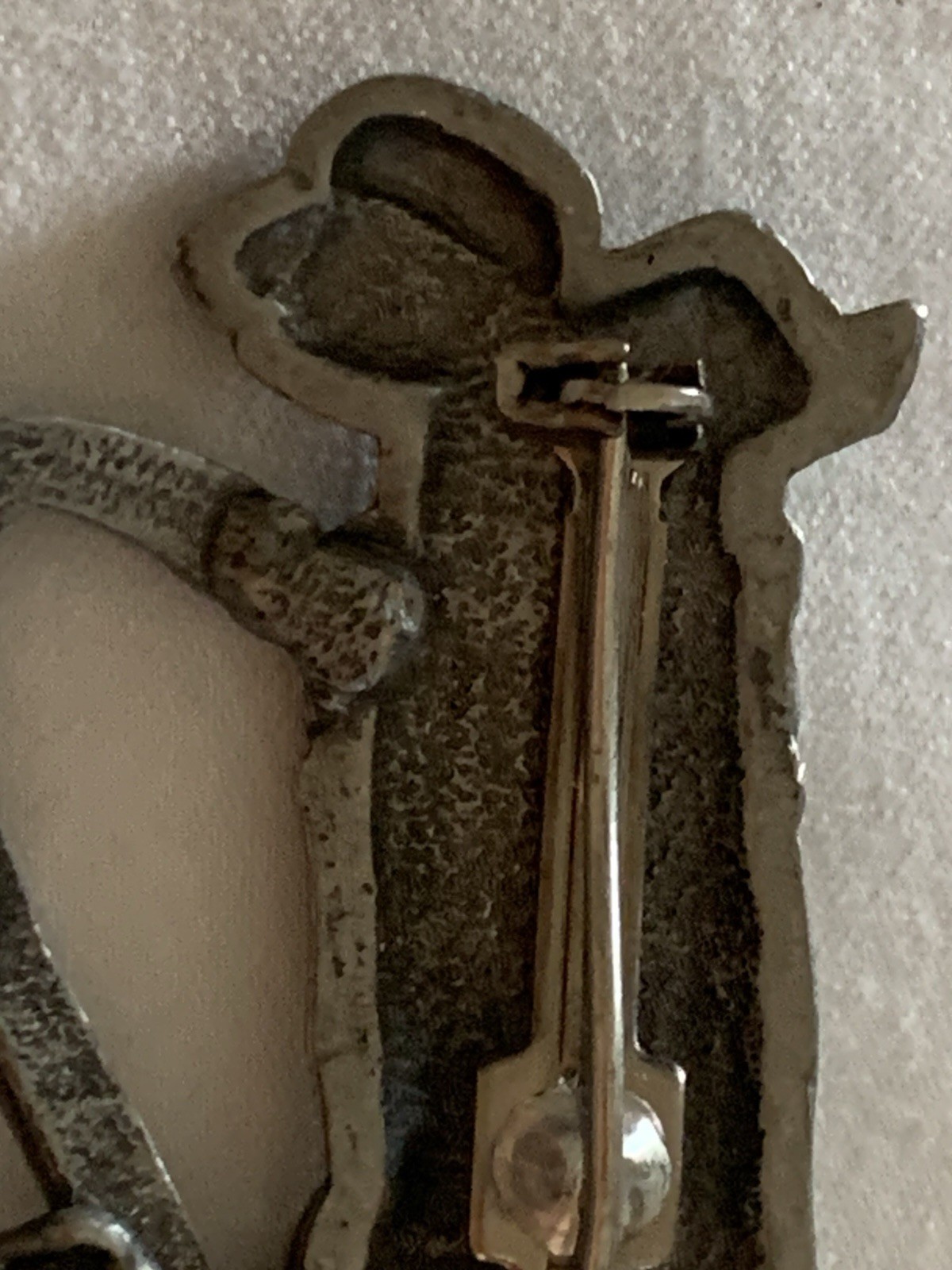 Jonette Jewelry (JJ) golf-themed brooch made of pewter or a similar alloy