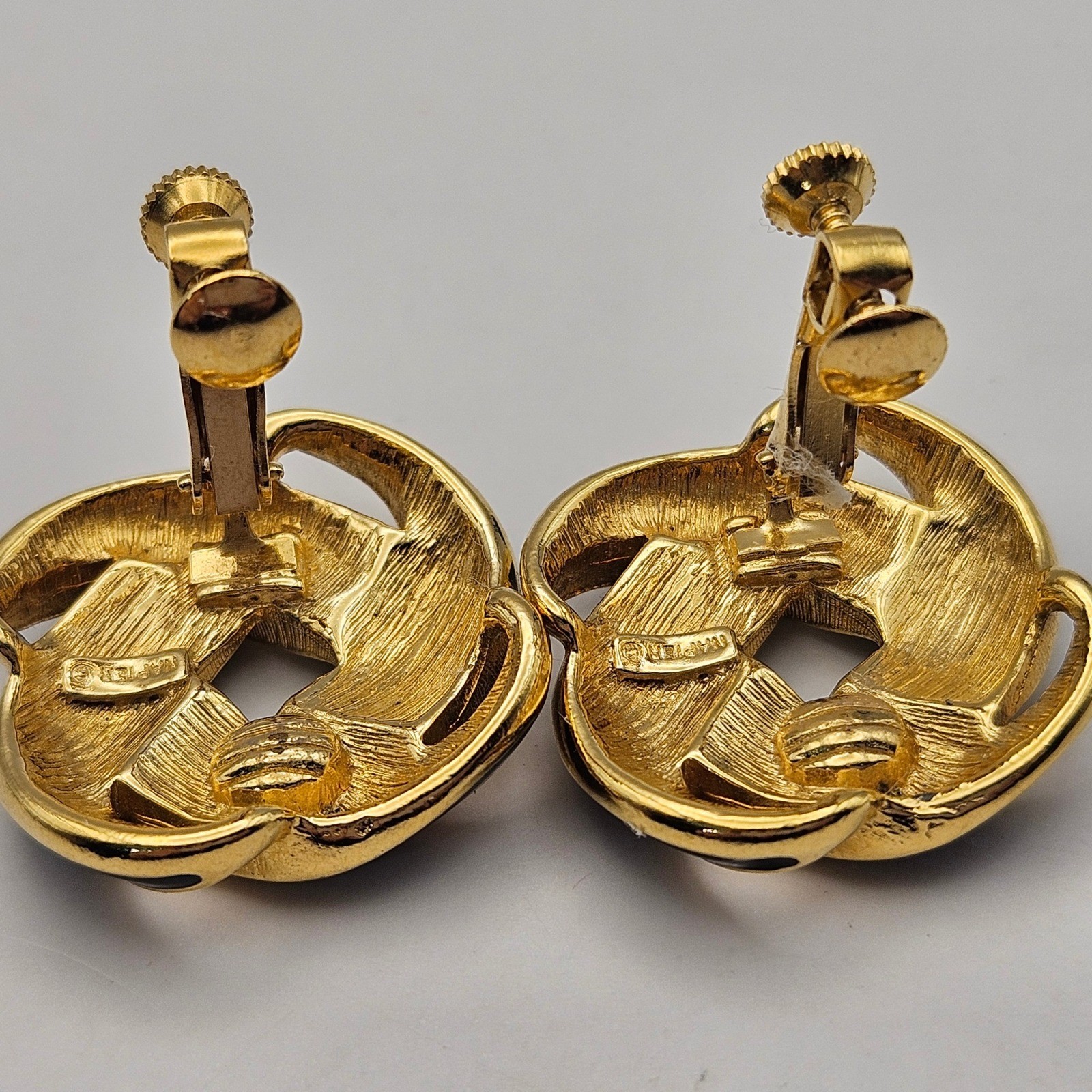 Napier Vintage Black Enamel Gold Tone Interlocking Knot Screw Back Clip Earrings