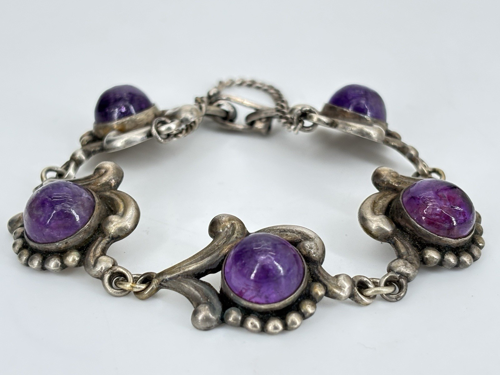 VTG LOS CASTILLO Taxco Sterling Silver Amethyst Floral Scrollwork Panel Bracelet