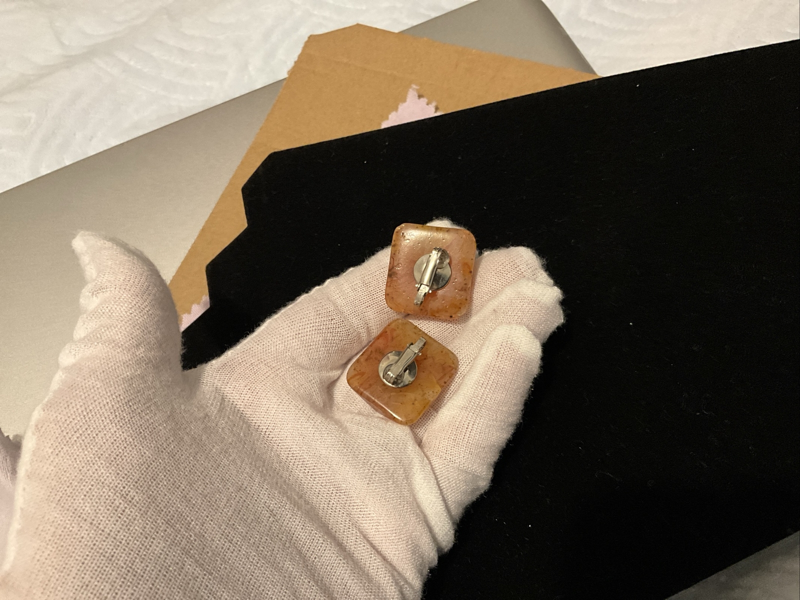 Bakelite Carved Apple Juice Clip On Earings About I 1/4 Inch Across 3/8 Thick.