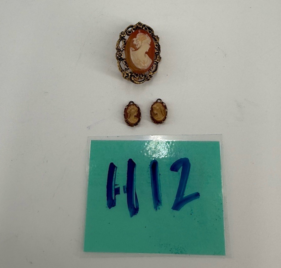 Vintage shell cameo brooch and 2 Small Pendants set in gold-tone metal.