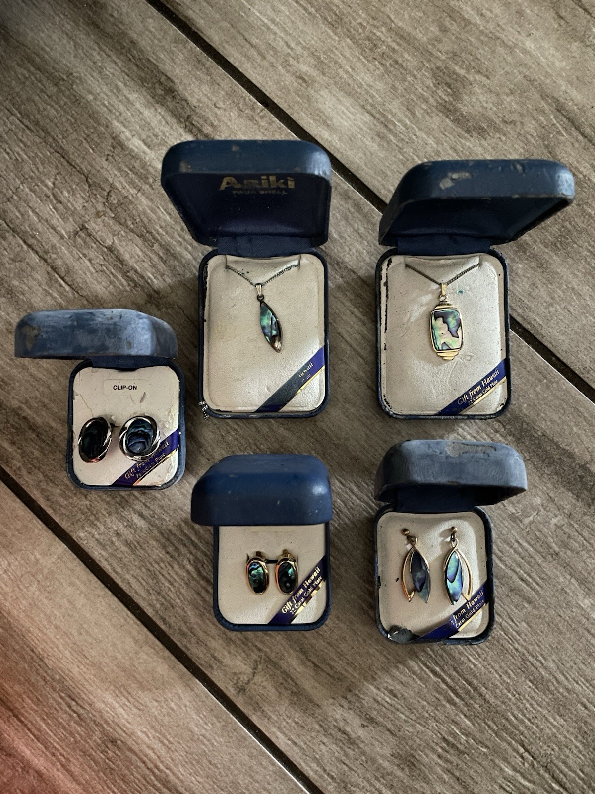 Vintage Ariki New Zealand paua shell jewelry sets in their original blue boxes.
