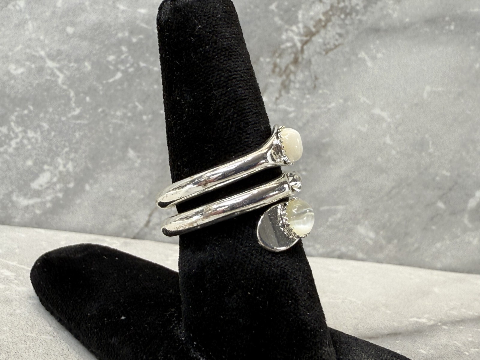 Silver tone wrap with white cat eye and righnstone ring size 6