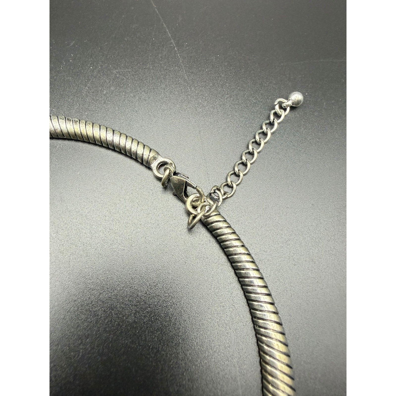 Vintage style silver-tone necklace with black enamel pendant