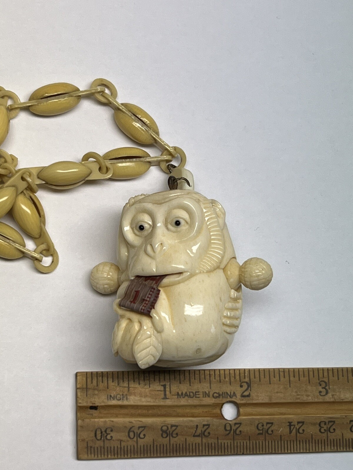 ANTIQUE ART DECO MONKEY NECKLACE TAPE MEASURE CELLULOID CHAIN PENDANT WHIMSICAL