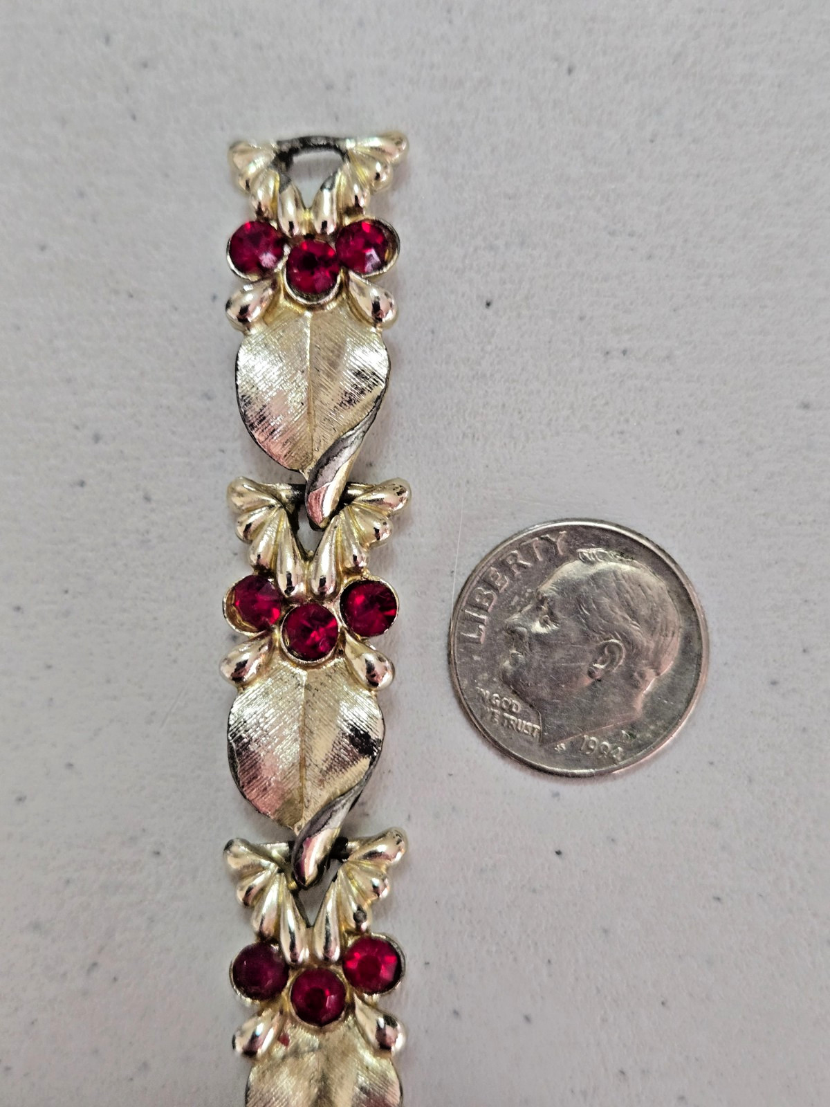 Vintage STAR Bracelet. Signed. Goldtone Setting with Red Rhinestone Accents.