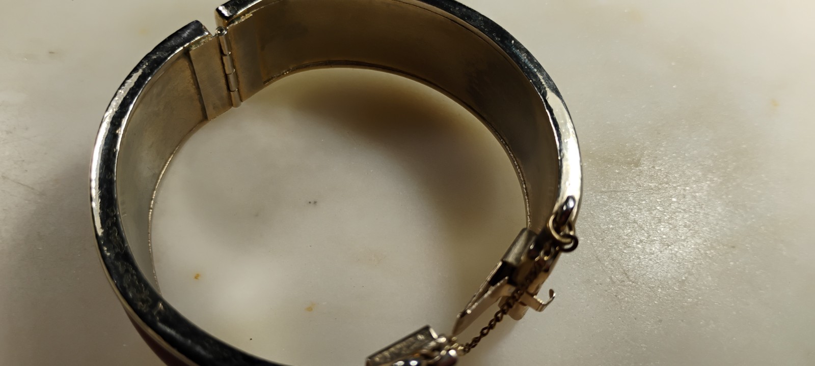 bergere goldtone hinge cuff bracelet inlaid w/soft redish brown material-nd6