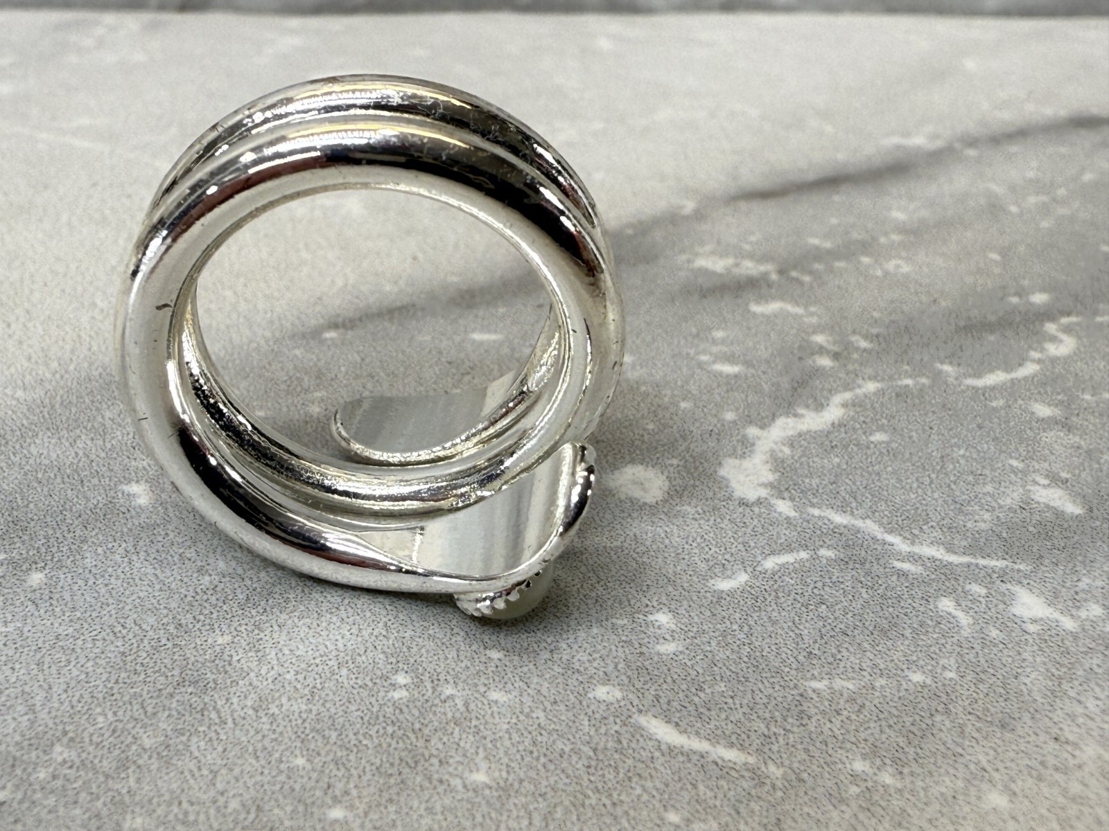 Silver tone wrap with white cat eye and righnstone ring size 6