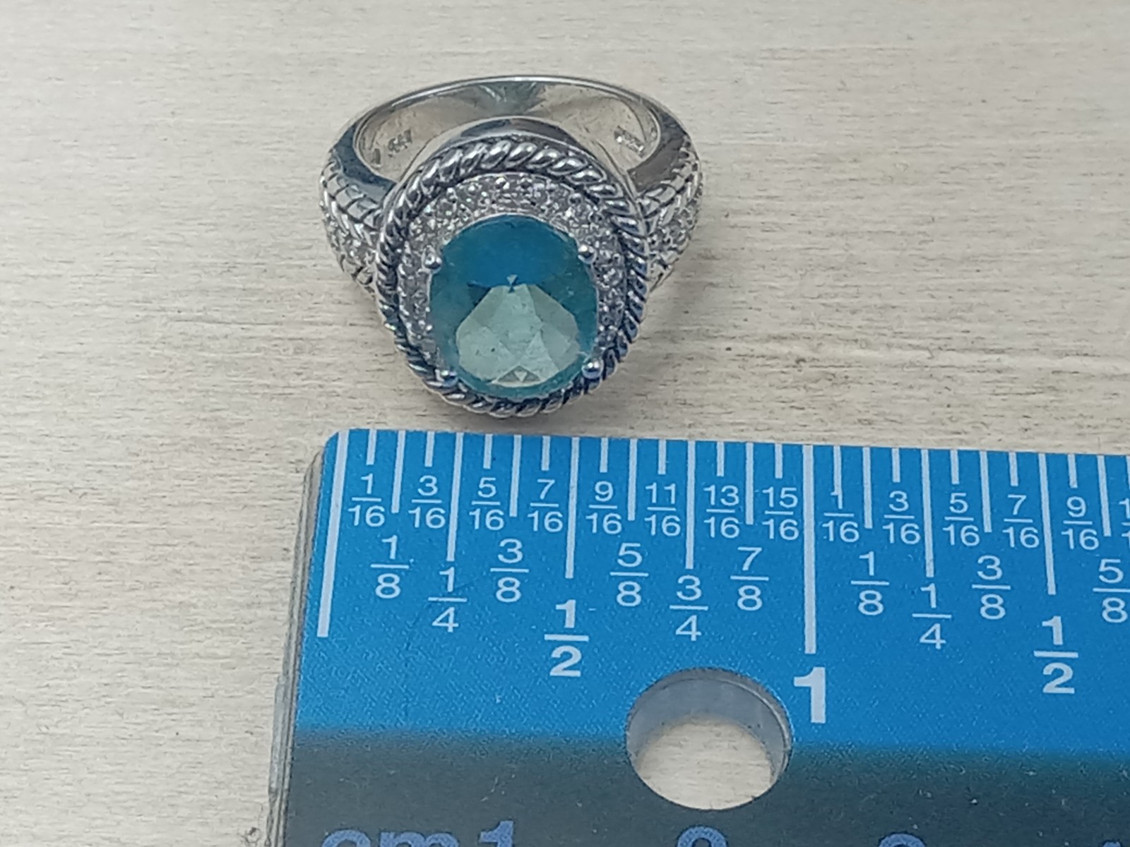Sterling Silver Ring w. Blue Topaz Oval Center Stone & Clear Trim Stones: Size 6