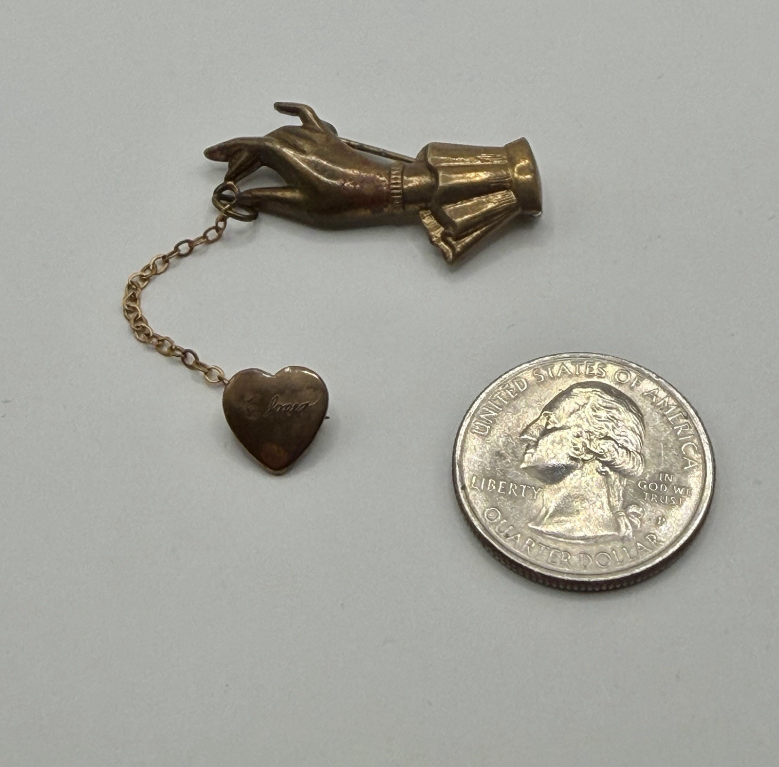 Antique Victorian Brass Hand Holding a Dangling Engraved Mini Heart Pin Brooch