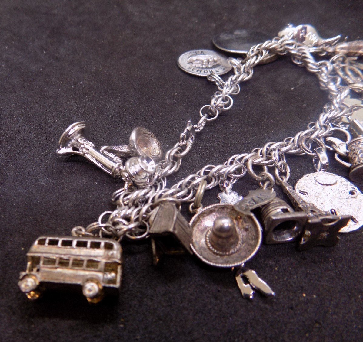 vintage silver charm bracelet loaded with charms alot are marked sterling (541)
