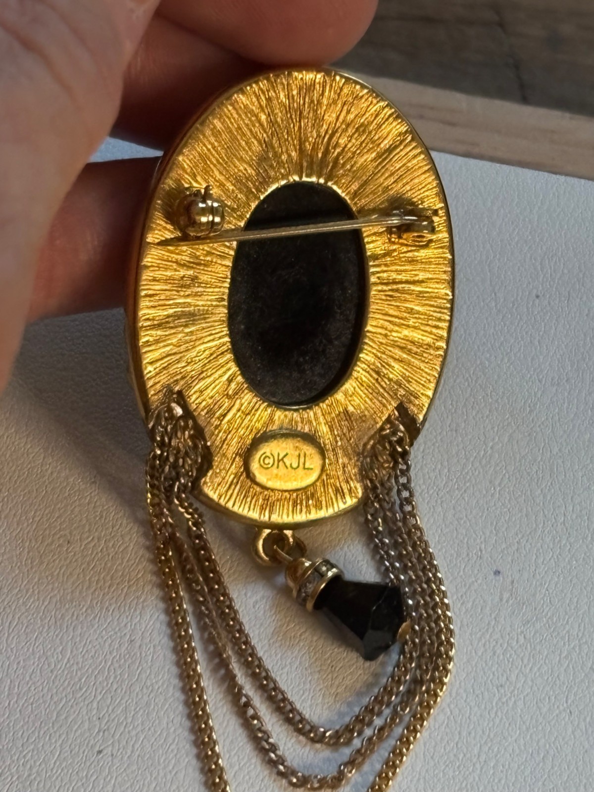 KJL signed Gold Tone Brooch With Black Stone & Crystal Accents
