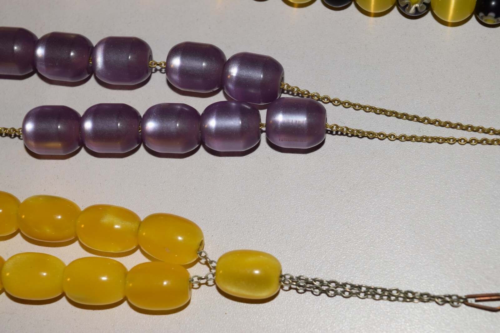 Vintage to now lot of 4 plastic beaded necklaces not sure what the 2 short ones
