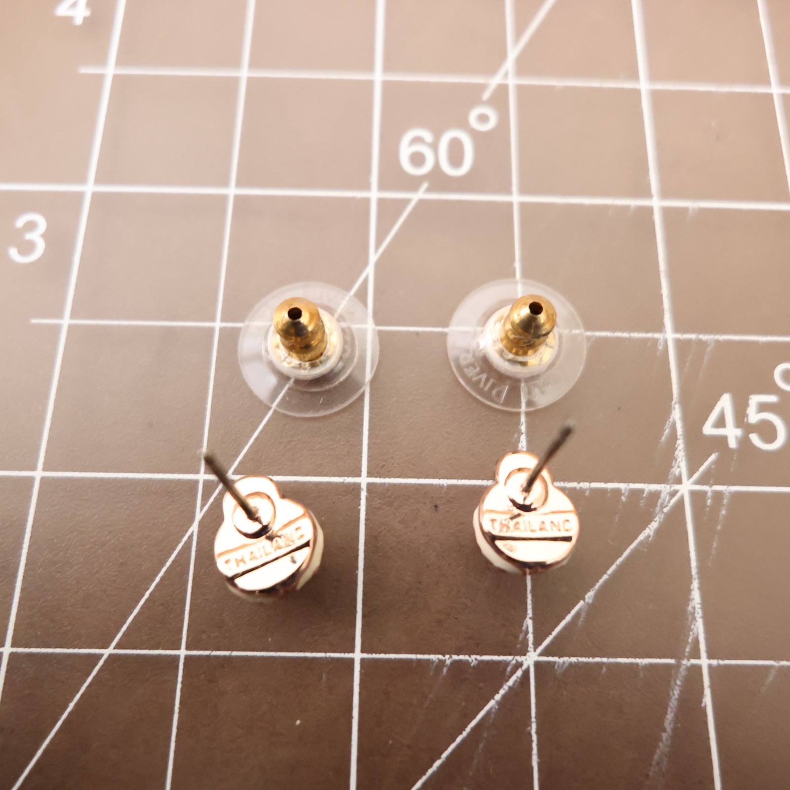 Joan Rivers earrings ladybugs white black enamel signed rose goldtone studs