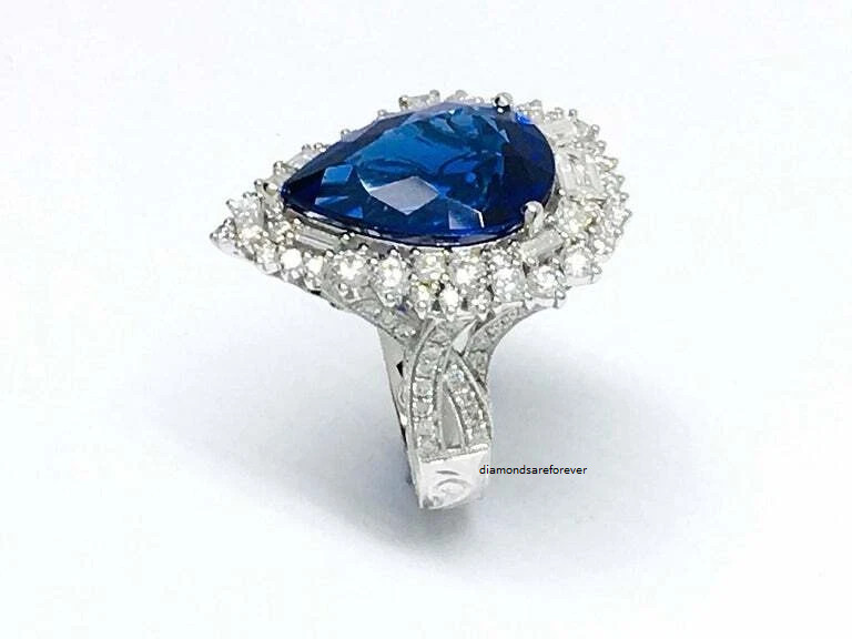 Beautiful Pear Shape 13.24CT Tanzanite & Different Shapes 3CT Shiny CZ Halo Ring