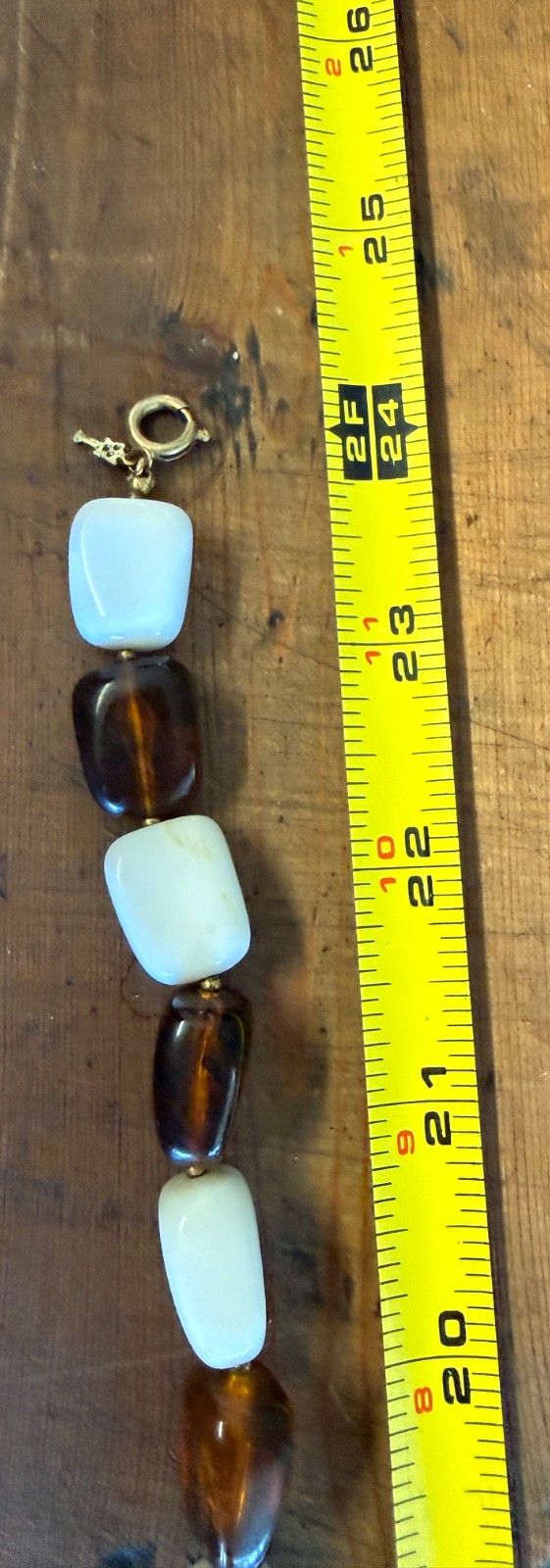 Vintage brown and white thermoset bakelite or lucite 24″ necklace Crown Trifari