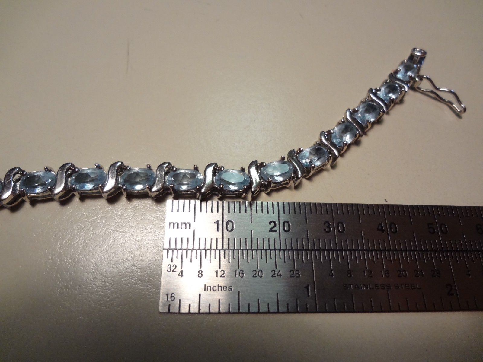 #48-DBJ-925 STERLING SILVER BRACELET LOADED WITH BEAUTIFUL STONES