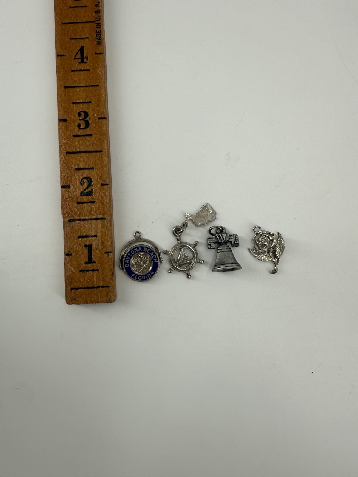 collection of vintage sterling silver souvenir charms from various locations