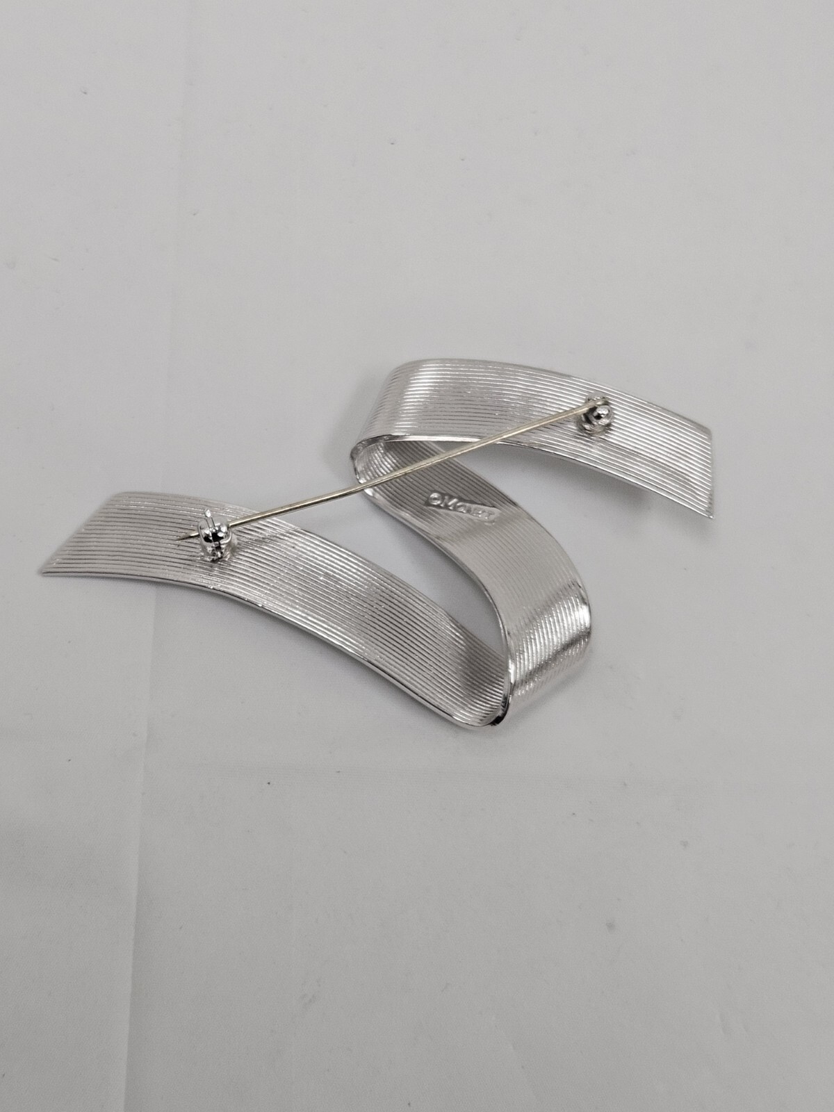 Vintage Monet Silver Tone Swirl Ribbon Pin Signed Mid Century Modern