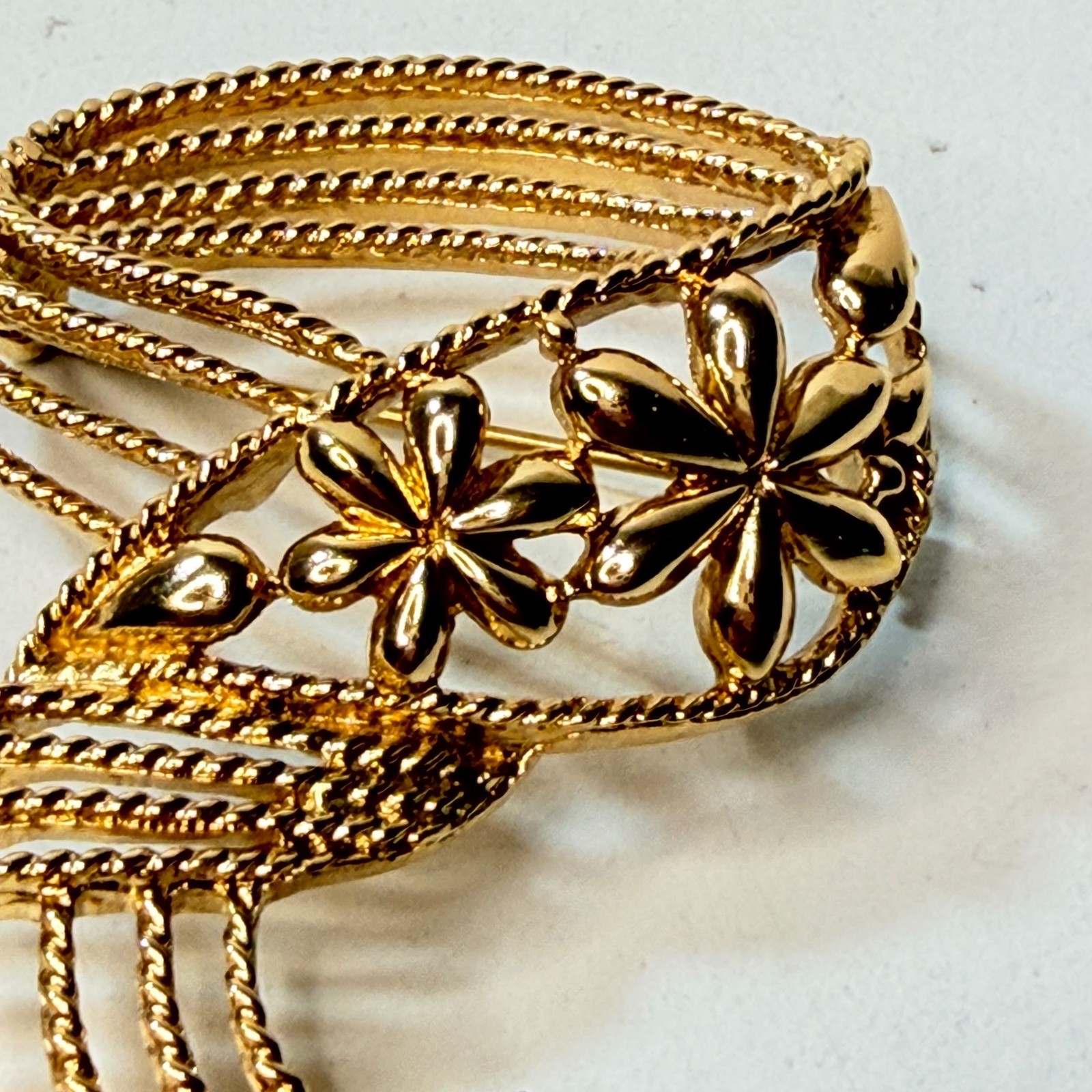 Monet Gold Tone Swirl Ribbon Flower Brooch Vintage Textured Floral Pin