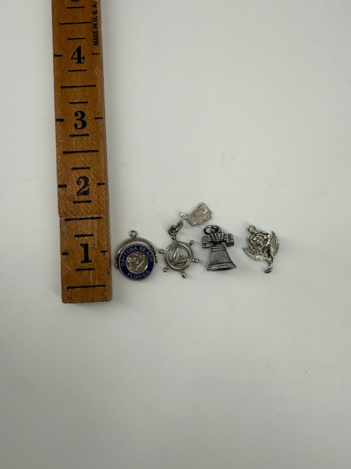 collection of vintage sterling silver souvenir charms from various locations