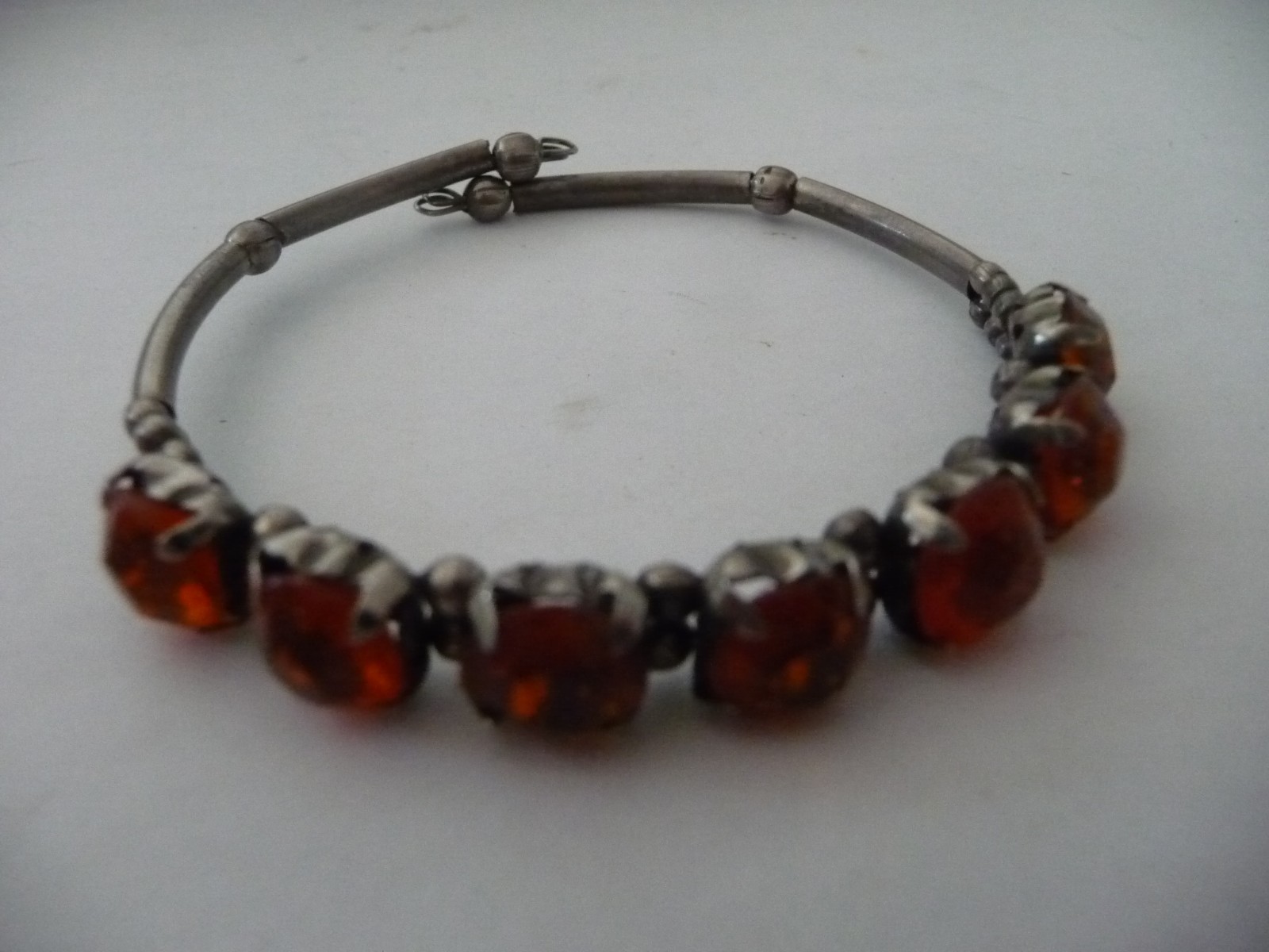 SILVER TONE WRAP AROUND W ORANGE STONE 1/4” W BRACELET #20/12