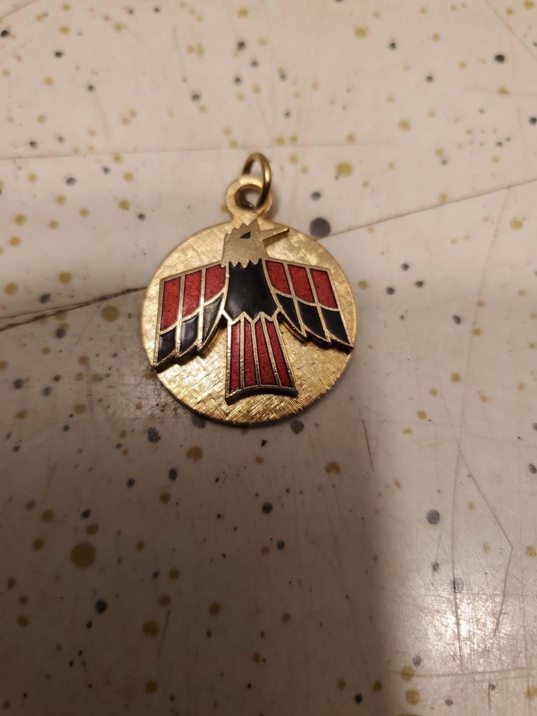 Vintage Red and Black on Gold colored Metal 1 inch Thunderbird Medallion Pendant