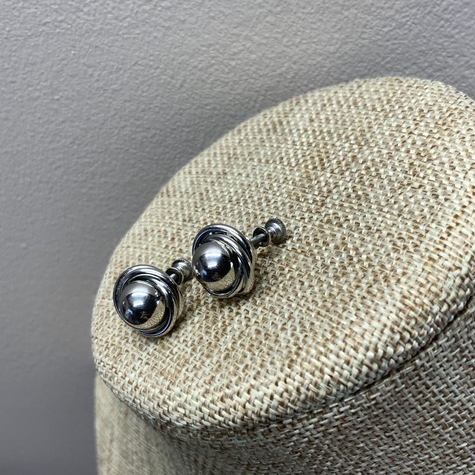 Vintage silver tone screw back knot earrings with dome