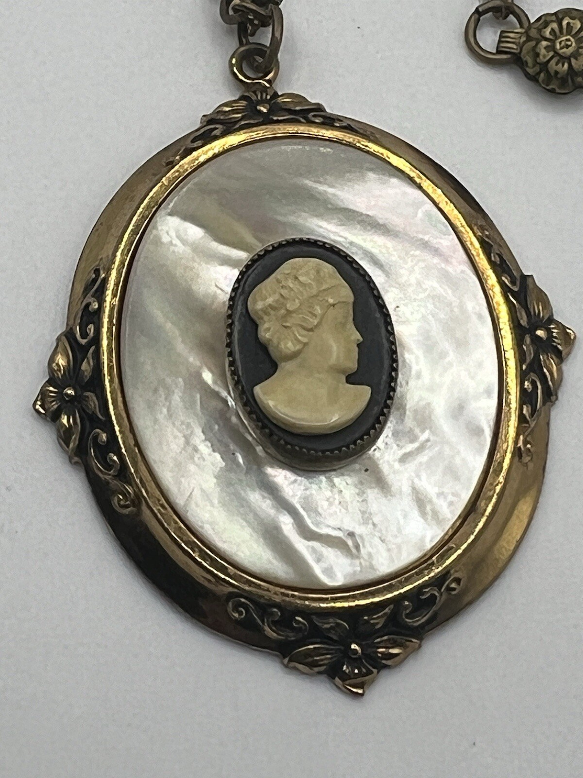 Mother of pearl faux cameo pendant necklace with gold frame and chain