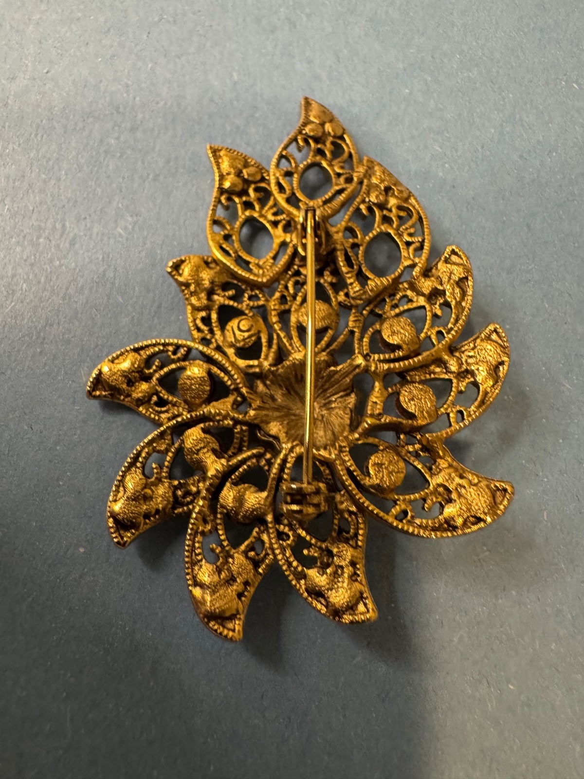 Gold Tone Brooch with Amber and Brown Glass Stones In A Floral or Leaf Design