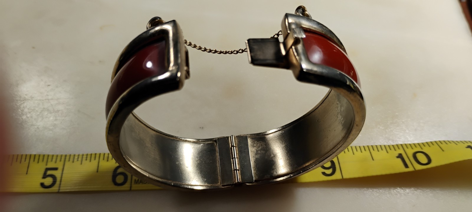 bergere goldtone hinge cuff bracelet inlaid w/soft redish brown material-nd6