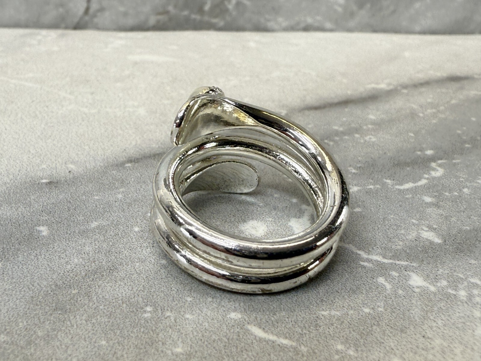 Silver tone wrap with white cat eye and righnstone ring size 6