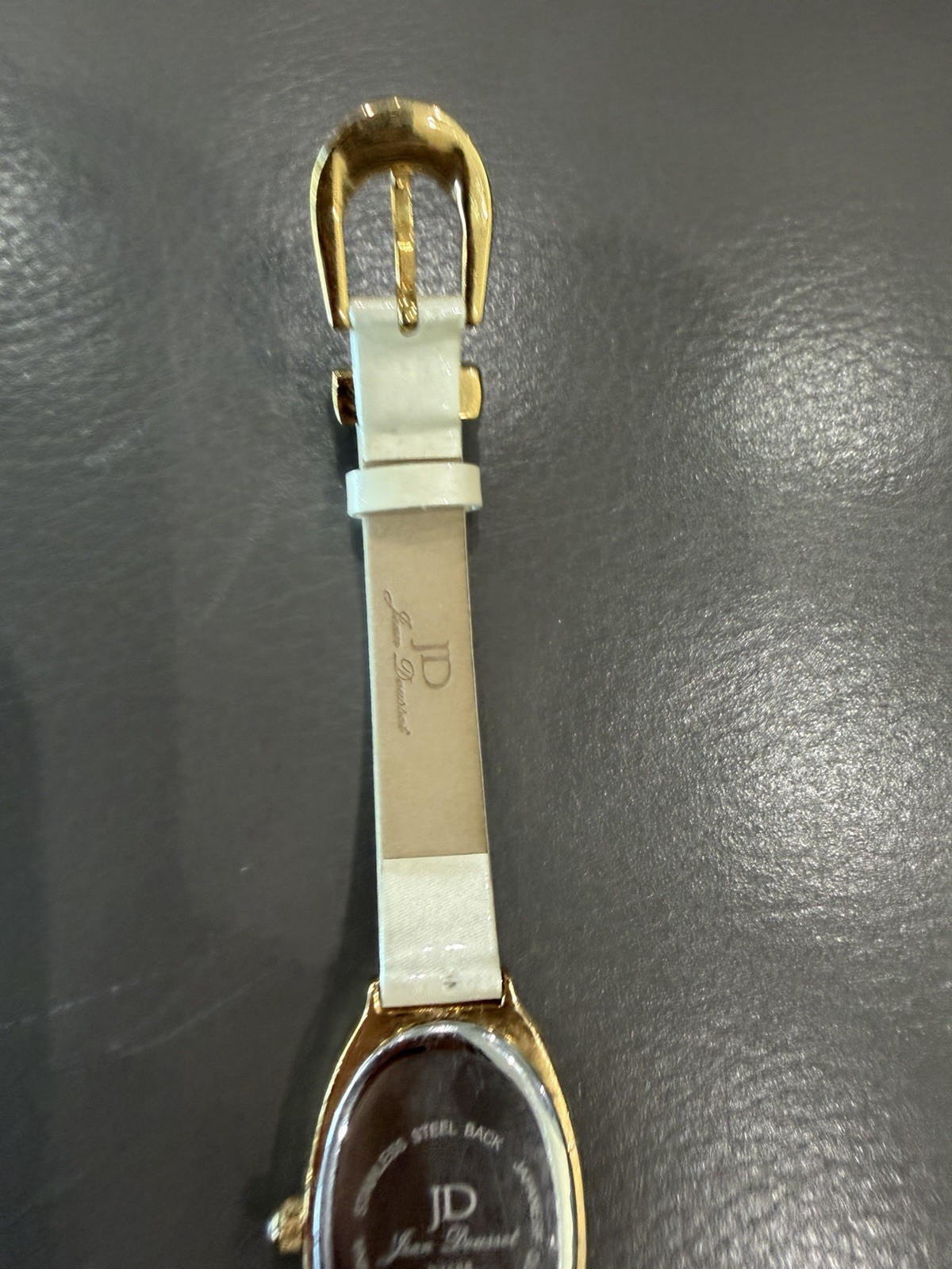 Vintage Jean Dousset Leather, Rhinestone Watch With Beige oval face.