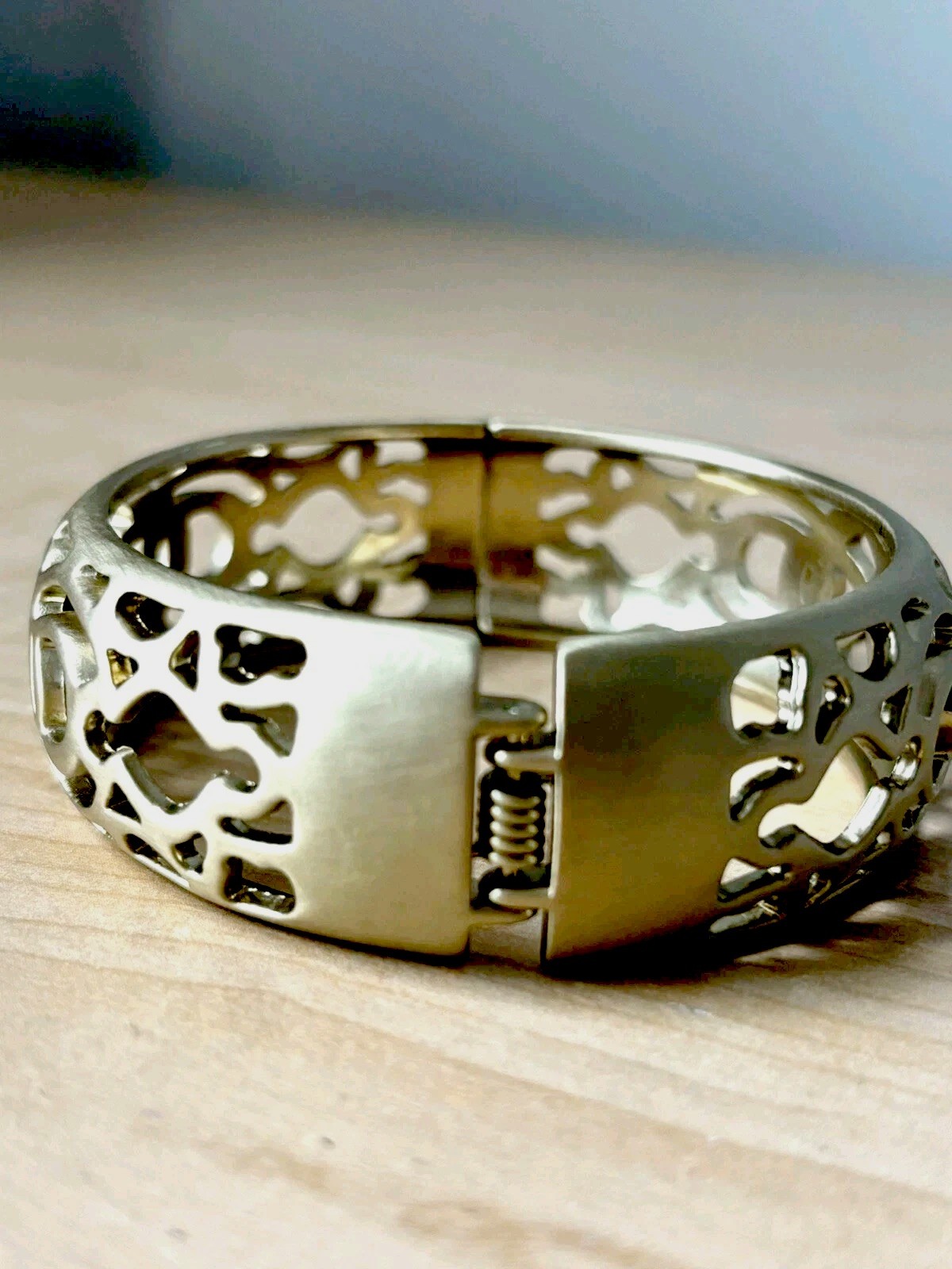 Open filigree hinge bracelet/ brushed antique gold tone/ size 6.75