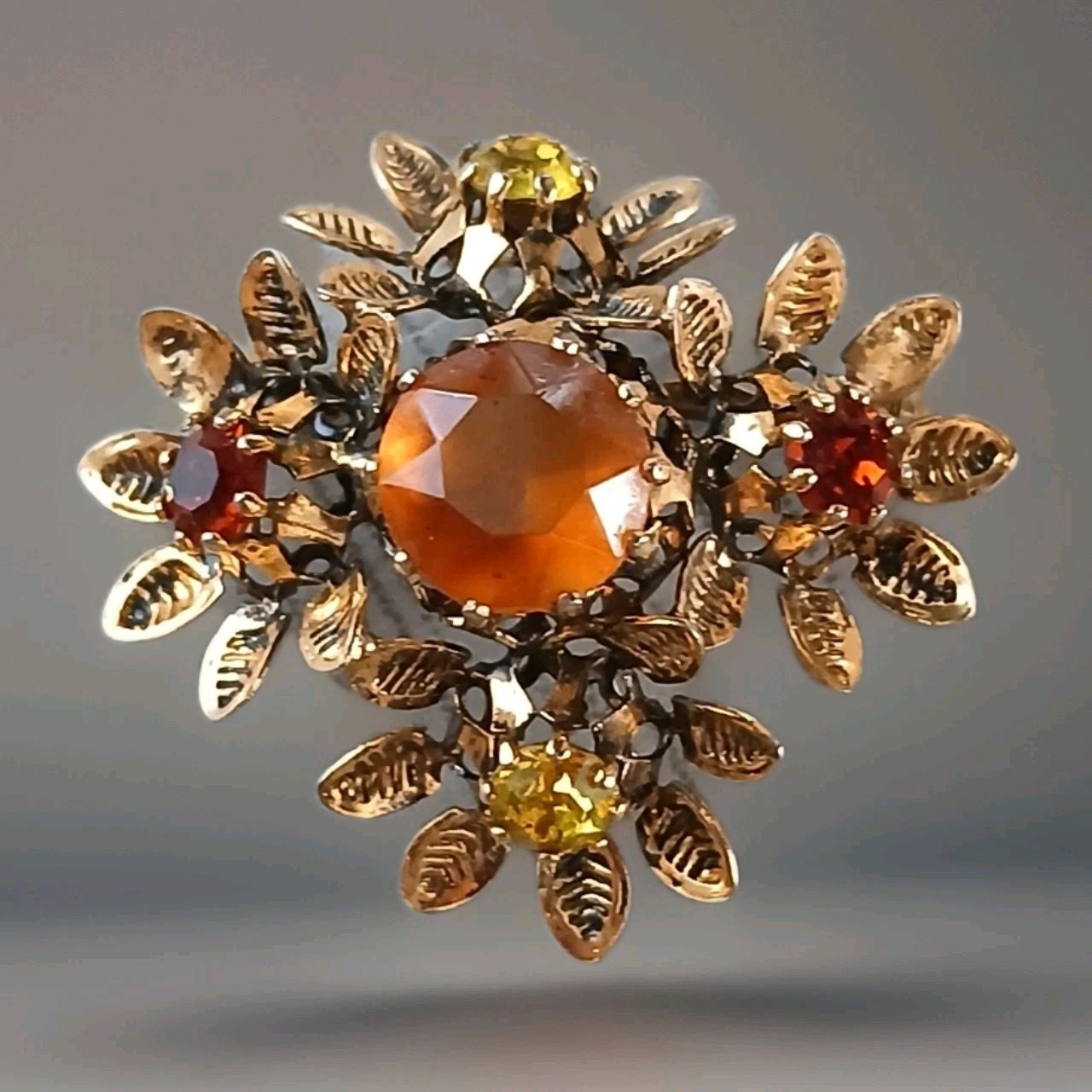 Vintage Austrian Amber Yellow Red Rhinestone Brooch W/Goldtone Leaves