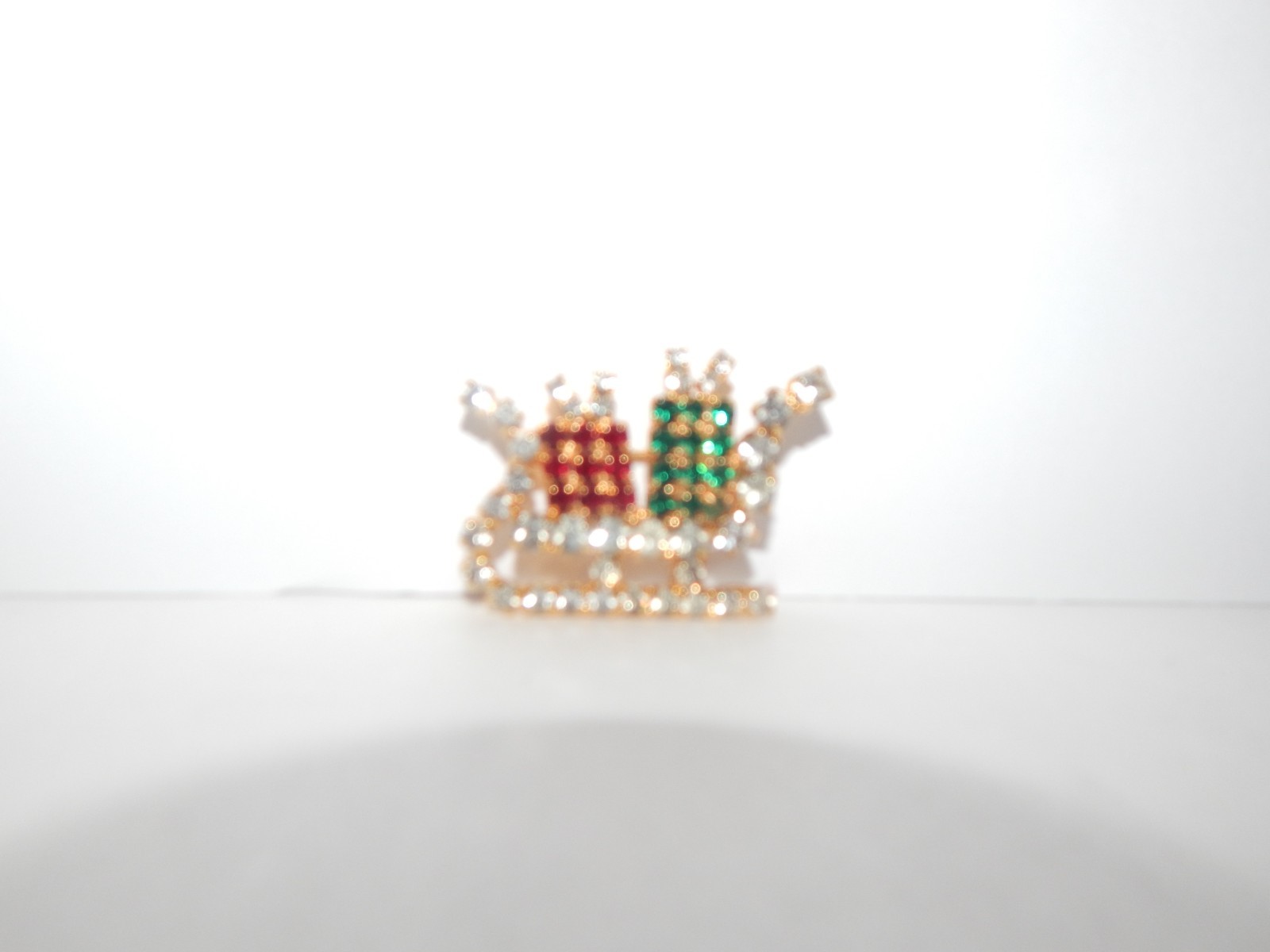 Vintage Gold Tone Green Red Rhinestone Present Holiday Sleigh Pin Brooch