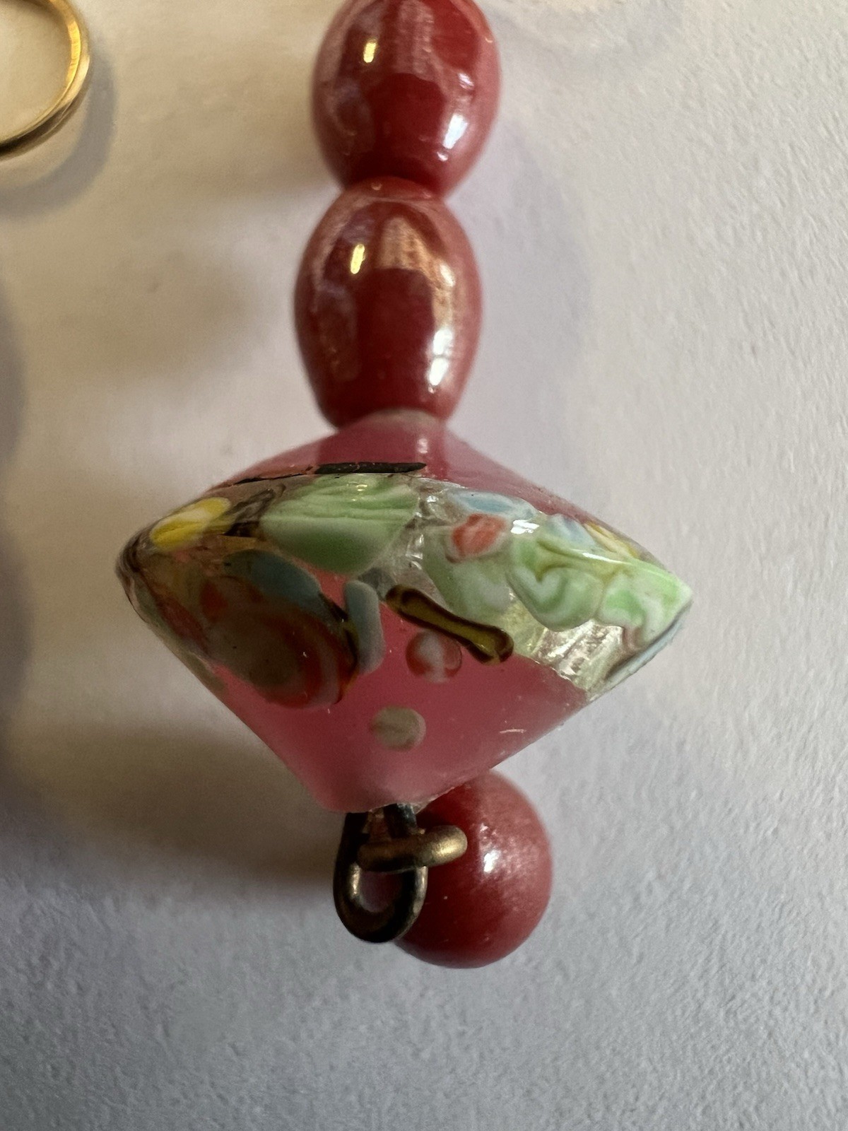 vintage-style dangle earrings featuring pink and green art glass beads