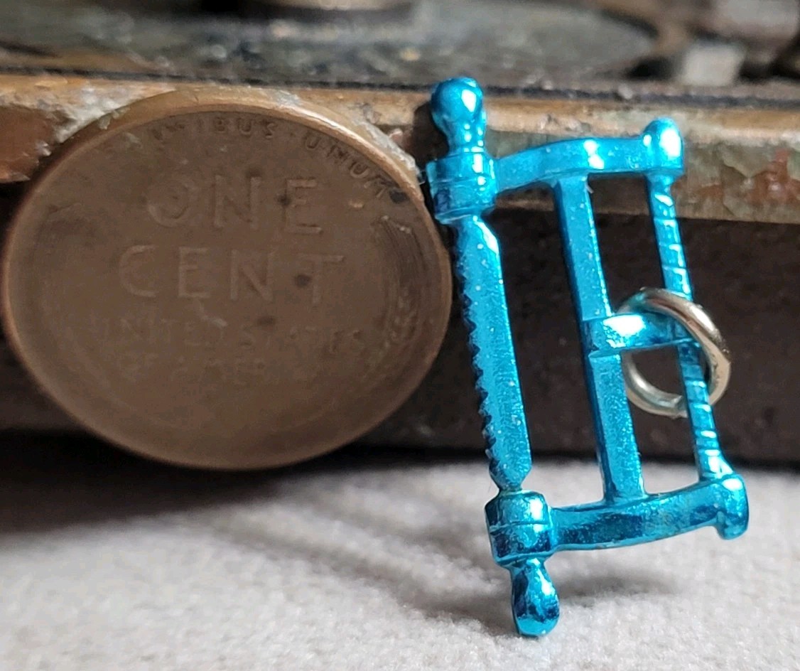 Vintage Blue Metal SAW charm prize jewelry