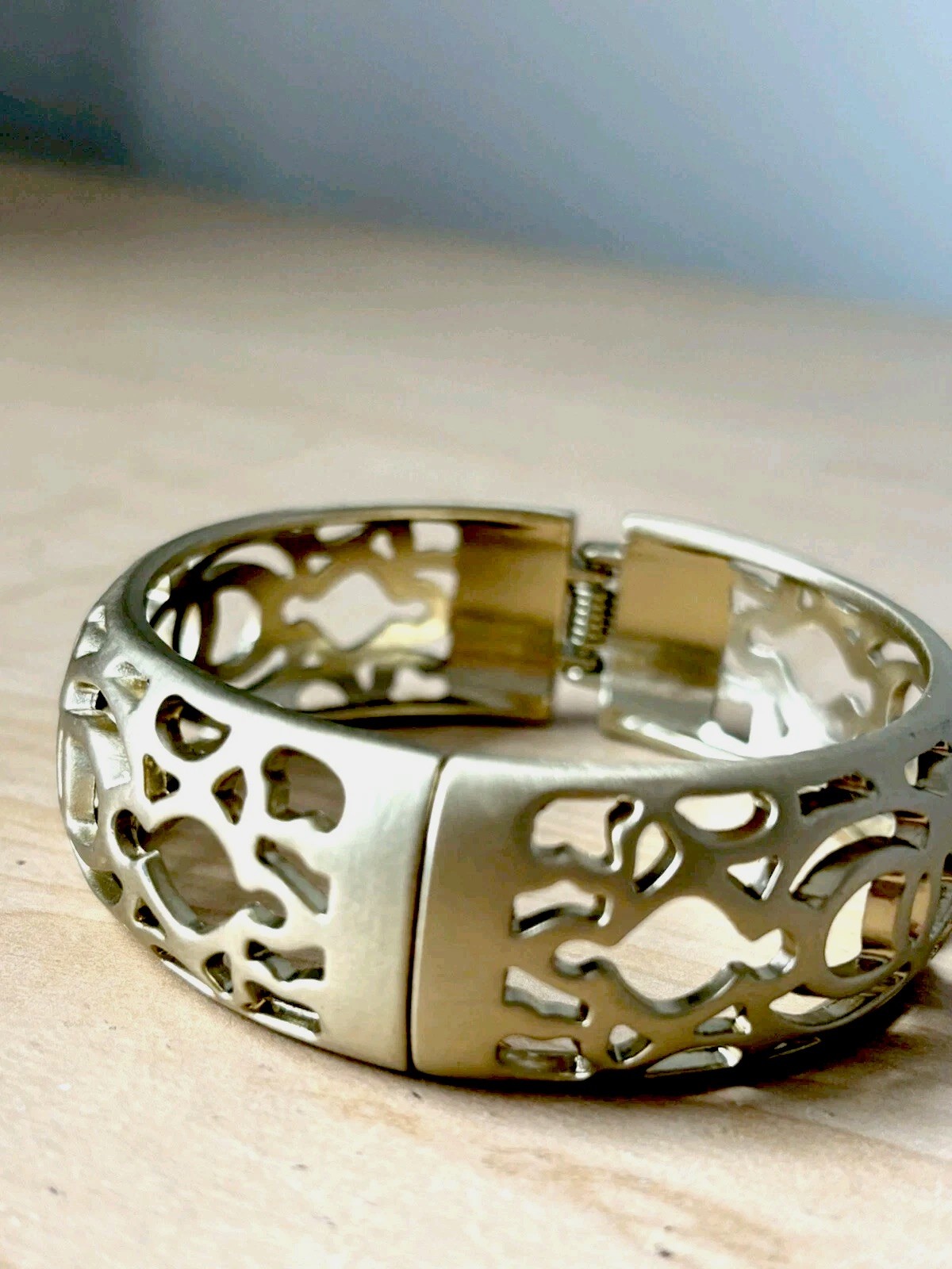 Open filigree hinge bracelet/ brushed antique gold tone/ size 6.75