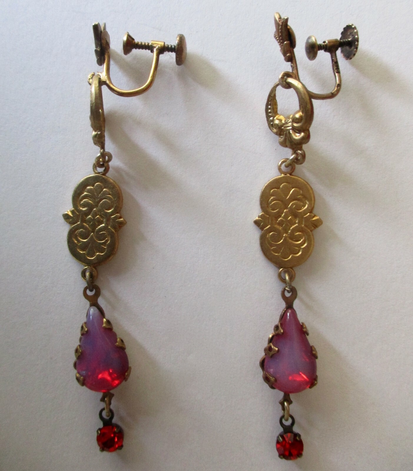 Pair of Antique Brass Screw Back Earrings With Opalescent Red Crystal Stones