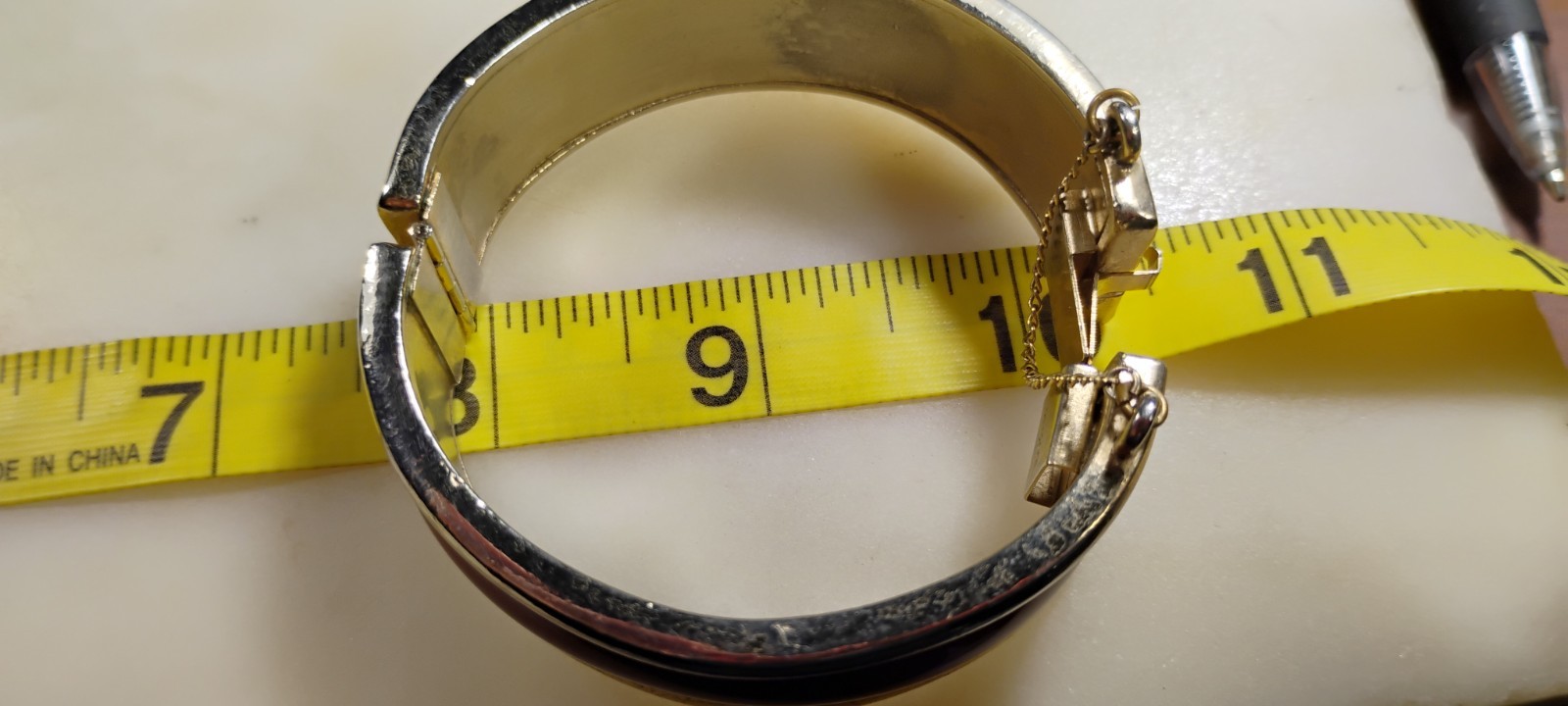 bergere goldtone hinge cuff bracelet inlaid w/soft redish brown material-nd6