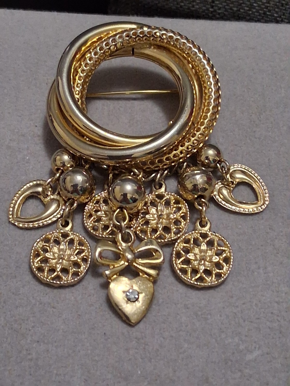 Interlocking circle charm brooch, gold-toned dangle drop charms