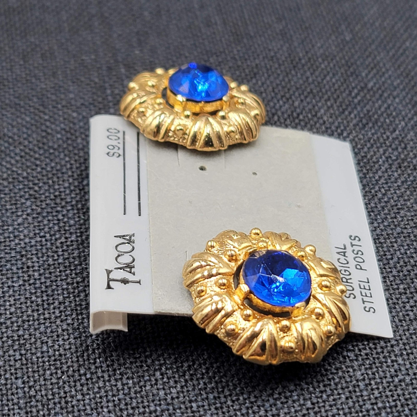 Vintage Tacoa Blue Rhinestone Pierced Earrings Embossed Gold tone NOS 1″