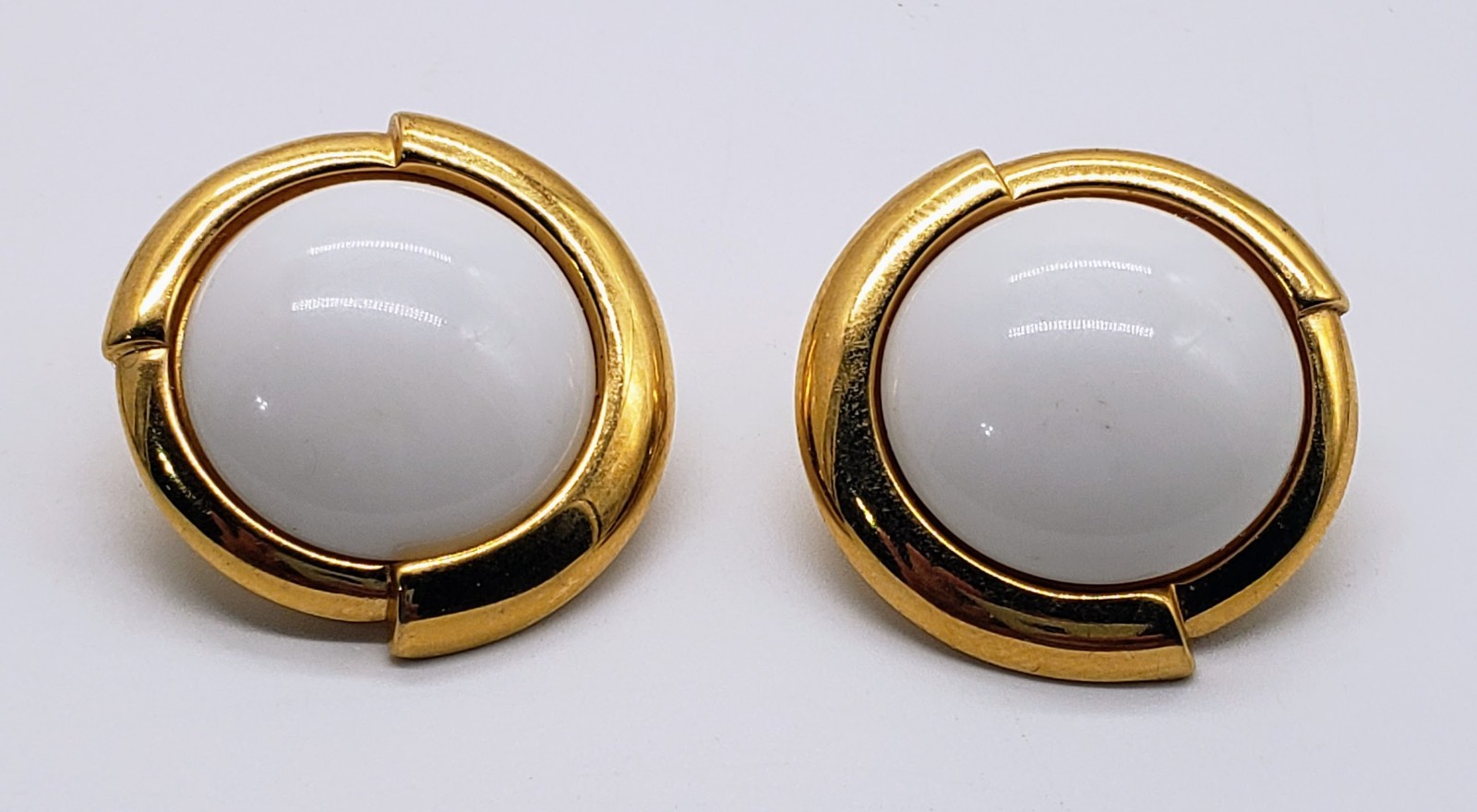 Vintage Monet Clip-on Earings. White on Gold-tone metal. About 1″ diameter