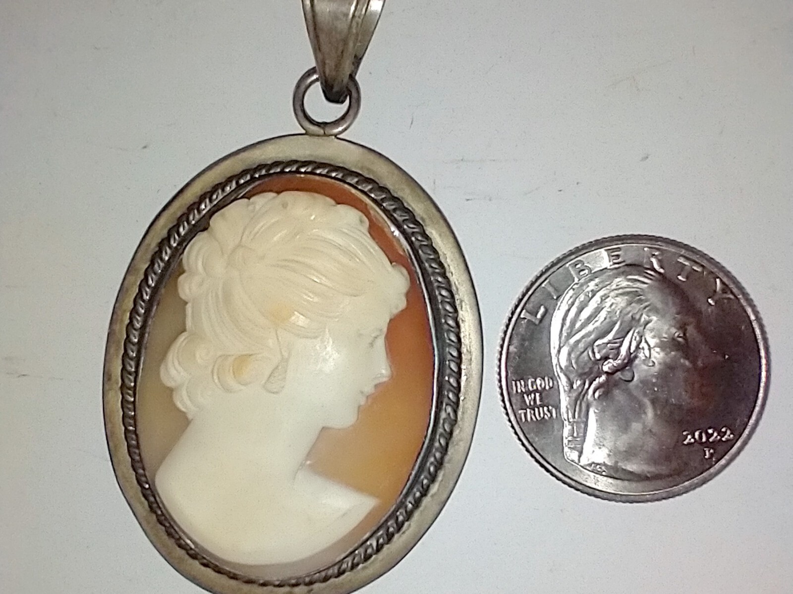 Old Cameo pendant 1.5 x 2 inches Almost looks like she has two faces